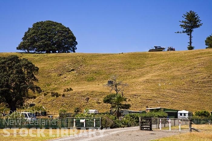 Waihou;Bay;church;bluffs;cliffs;rocky shorelines;sea fishing;Marai;Maori carving;Maori warrior;bush;mountains;bush;native forrest;bachs;holiday homes;golden light;sea fishing;Boat