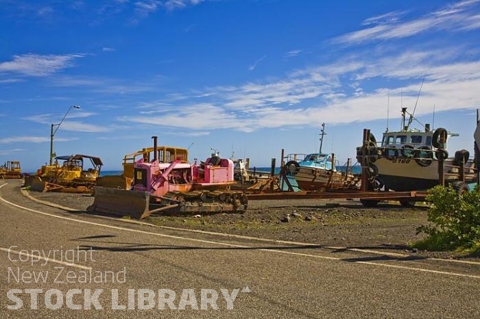 Palliser Bay;Wairarapa;rocky shoreline;coast road;lighthouse;seals;bachs;holiday homes;blue sky;blue sea;bluffs;cliffs;Ngawi;Babe;Bulldozer;Launching;boat launching