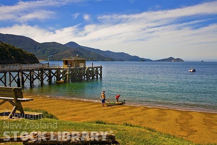 Aerial;Marlborough Sounds;Marlborough;bush;native forrest;hills;mountains;French Pass;Kayakers;Jetty;pier;sandy beach