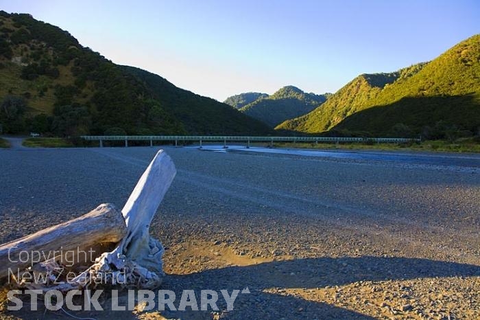 Raukokore;Papatea Bridge;church;bluffs;cliffs;rocky shorelines;sea fishing;Marai;Maori carving;Maori warrior;bush;mountains;river mouth;road bridge.long road bridge;driftwood