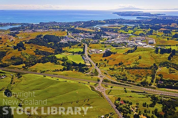 Aerial;Silverdale;Rodney;golden sands;blue sky;blue sea;cumulus clouds;sub division;Silverdale;Red Beach;motorway interchange;motorway;interchange;junction;industrial buildings;industrial building