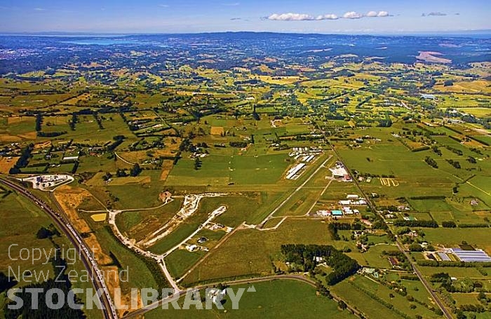 Aerial;Silverdale;Rodney;North Shore Airfield;Northern Motorway;Auckland blue sky;blue sea;cumulus clouds;sub division;North Shore;Airfield