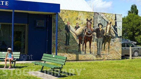 Katikati:;murals;child;child on public bench;child on park bench