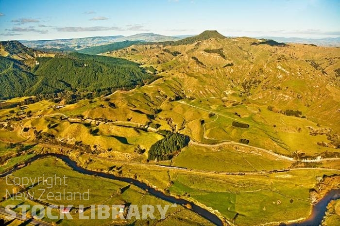 Aerial;Taumarunui;South Waikato;airport;agricultural;Timber;timber industry;river;Trout Fishing;Scenic flights;agriculture;sheep;rail line rail link;rail station;Ongarue River;train on track;top dressing strip