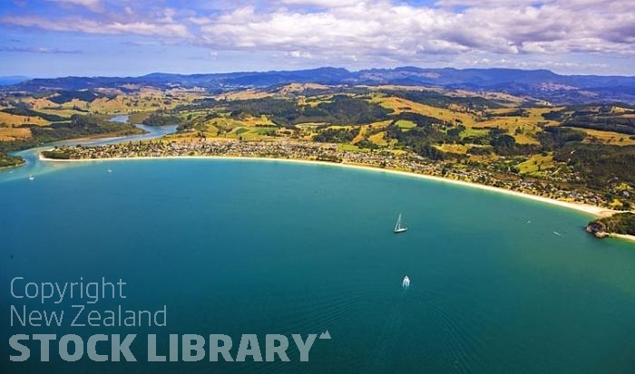 Aerial;Coromandel Coastline;Coromandel;sandy beaches;bachs;holiday homes;blue sky;blue sea;bush;native forrest;River;boating;bluffs;cliffs;islands;river estury;estury;boating;boats;yachts;speed boats;harbour;green;sea;cumulus clouds;Cooks Beach