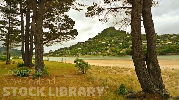 Pauanui;sandy beaches;bachs;holiday homes;blue sky;blue sea;bush;native forrest;River;boating;bluffs;cliffs;boats;kayaks;kayaking;harbour mouth;Tokaroa Point