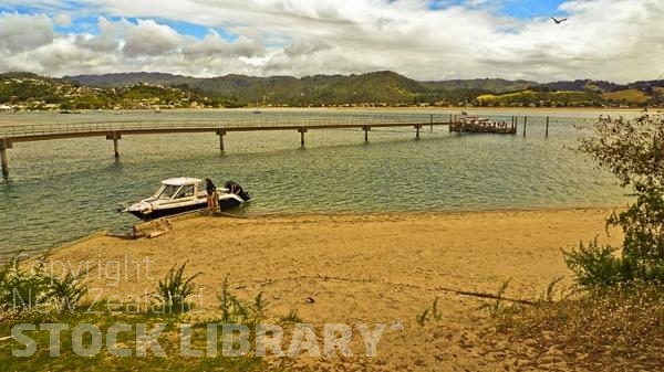 Pauanui;sandy beaches;bachs;holiday homes;blue sky;blue sea;bush;native forrest;River;boating;bluffs;cliffs;boats;kayaks;kayaking;ferry;jetty;Pauanui;Tairua