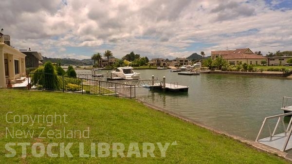 Pauanui;Coromandel;sandy beaches;bachs;holiday homes;blue sky;blue sea;bush;native forrest;River;boating;bluffs;cliffs;boats;kayaks;kayaking;motor boat;launch