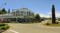 Opotike;blue_sky;Rostcards_Building;District_Council_landscaping;totem_pole;town