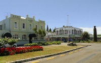 Opotike;blue_sky;Rostcards_Building;District_Council_landscaping;totem_pole;town