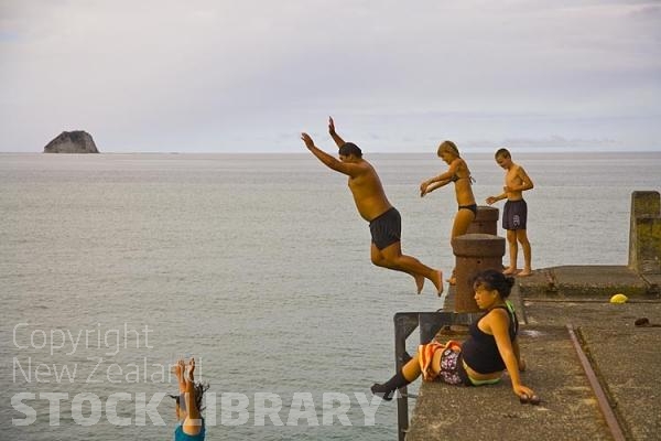 Tolaga Bay;Eastland;bush;native forrest;golden sands;bluffs;Uawa Rivercliffs;wharf;sandy beaches;sand dunes;children jumping from the wharf;children;jumping;wharf;children jumping;wharf