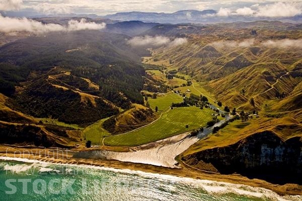 Aerial;Hawkes Bay Coast;bush;native forrest;golden sands;bluffs;River;cliffs;sandy beaches;vineyards;blue sky;blue sea;Waipatiki Beach