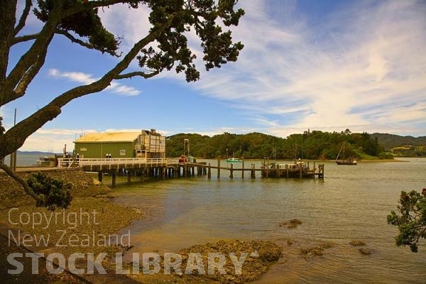 Mangonui;Northland;sandy beaches;bachs;holiday homes;bush;native forrest;golden sands;blue sky;blue sea;Pohutakawa trees;boats boating;fishing;fishing boats yachts;kayaks;Commercial fishing wharf;Commercial fishing;wharf