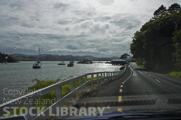 Mangonui;Northland;sandy beaches;bachs;holiday homes;bush;native forrest;golden sands;blue sky;blue sea;Pohutakawa trees;boats;boating;fishing;fishing boats;yachts;kayaks;Harbour