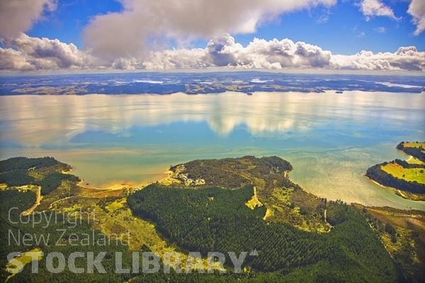 Aerial;Kaipara Harbour;Rodney;green fields;paddocks;Tasman Sea;blue sky;blue sea;Kellys Bay