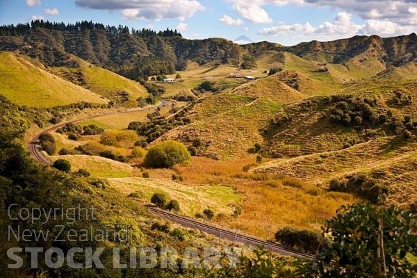 Forgotten World Highway;Taranaki;Mount Taranaki;Mount Egmont;River;Rivers;bush;native forrest;landscape;Pohokura Saddle View;Pohokura Saddle;View;Rail line;winding Rail line;sheep country;steep country