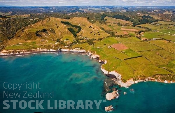 Aerial;West Coast Waikato;Waikato;coastal;bachs;holiday homes;bush;native forrest;blue sky;blue sea;boating;Fishing boats;bluffs;cliffs;black sands;rocky shorelines;sandy beaches;sheep country;Tasman sea;black;sands;caves