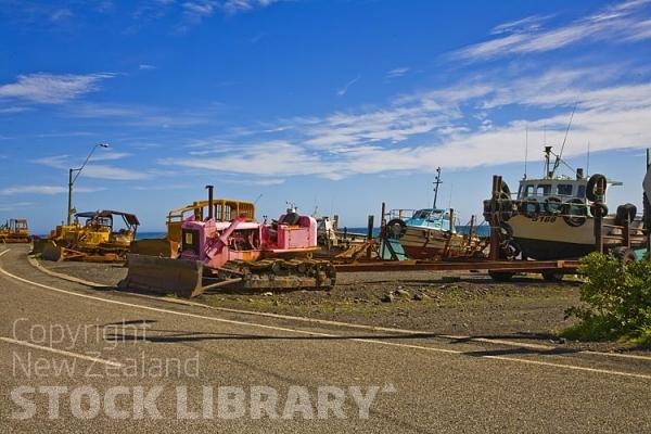 Palliser Bay;Wairarapa;rocky shoreline;coast road;lighthouse;seals;bachs;holiday homes;blue sky;blue sea;bluffs;cliffs;Ngawi;Babe;Bulldozer;Launching;boat launching