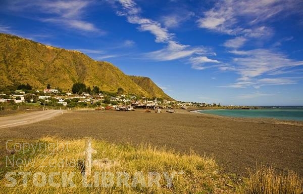 Palliser Bay;Wairarapa;rocky shoreline;coast road;lighthouse;seals;bachs;holiday homes;blue sky;blue sea;bluffs;cliffs;fishing village;fishing;commercial fishing