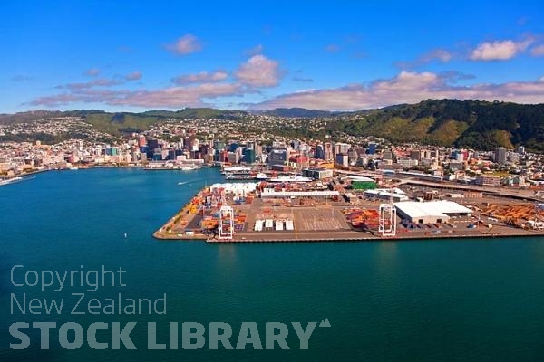 Aerial;Wellington;Beehive;parliament;down town;highrise;airport;bays;marina;docks;harbour;ferries;port;clear water;cranes;cafes;restaurants;motorway;traffic;boats;planes;aircraft;helicopters;caketin;rugby stadium;railwat station;rail lines;logs;piles of logs;logging