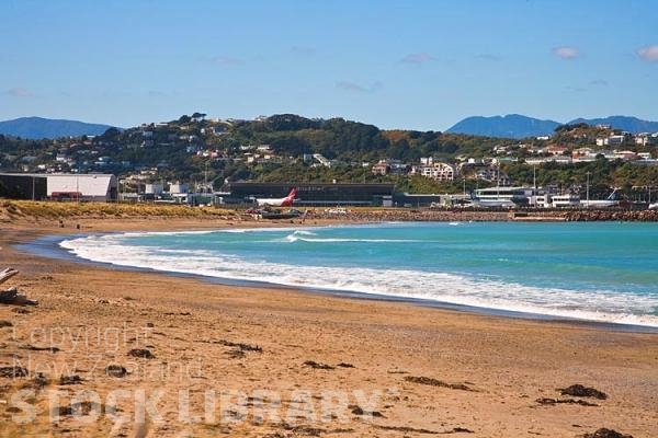 Wellington;Beehive;parliament;down town;highrise;airport;bays;marina;docks;harbour;ferries;port;clear water;cranes;cafes;restaurants;motorway;traffic;boats;planes;aircraft;helicopters;caketin;rugby stadium;railwat station;rail lines;Lyall Bay