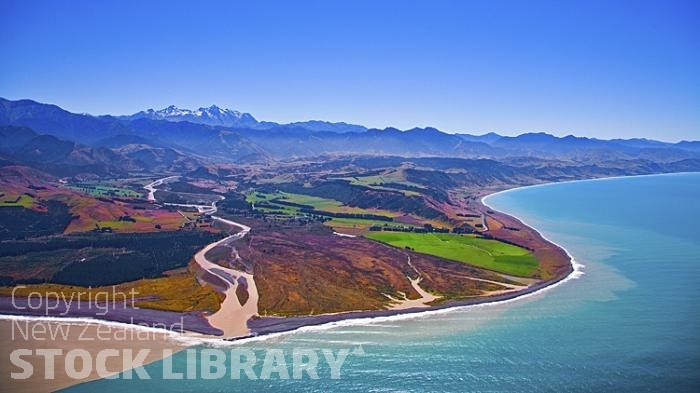 Aerial;Kaikoura Coast;Kaikoura;bush;native forest;seaward Kaikoura Range;green fields;paddocks;brown hills;hills;mountains;rivers;ocean;pacific ocean;Clarence River Mouth