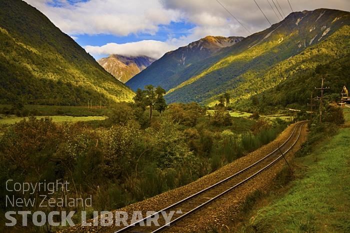 Arthur's Pass Route;West Coast;mountains;hills;Lakes;tussock grass;tussock;bush;native forrest;state highway 73;scree;rocky out crops;boulders;sheep;Rail Near Aikens;Rail;Aikens;Rail line