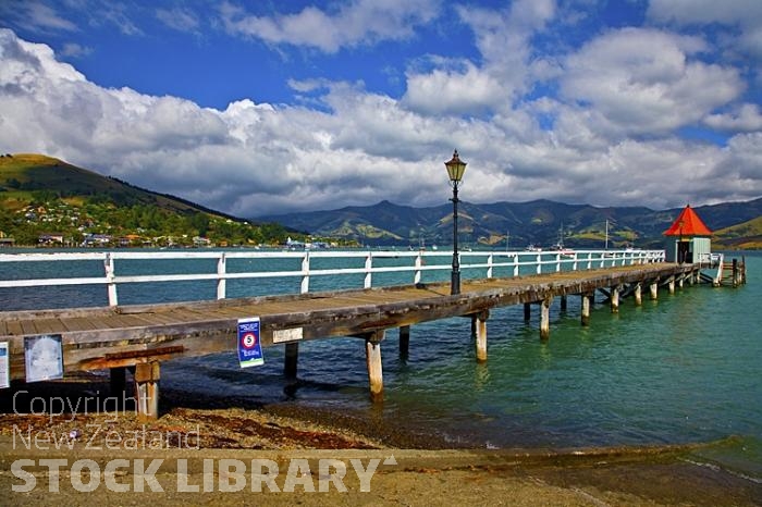 Banks Peninsula;Canterbury;Green Paddocks;green fields;bush;native;forrest;french settlement;french culture;harbour;Akaroa;Akaroa Harbour;Akaroa Pier;lamp post;moorings;moored boats