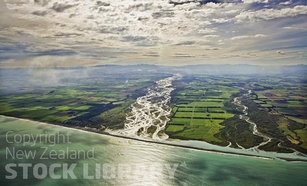 South Canterbury Coast;Canterbury;hills;Canterbury Plain;coastline;golden sands;green fields;paddocks;green paddocks;rivers;Pacific ocean;Raikaia River Mouth;braided river