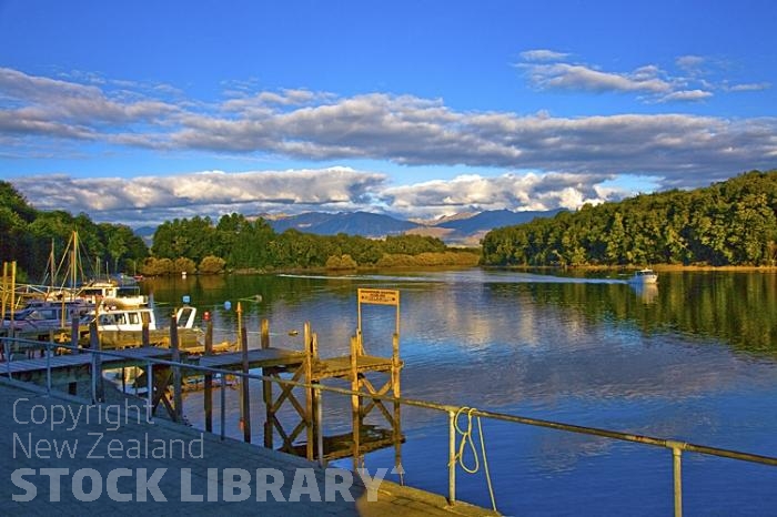 Lake Manapouri;Fiordland;mountains;hills;rivers;Road;State Highway 95;bush;native forrest;green fields;green paddocks;lakes;blue sky;Manapouri;Manapouri Township;Manapouri Village;Manapouri town;airport;fiordland airport;Waiau River;Pearl Harbour;boats;boating