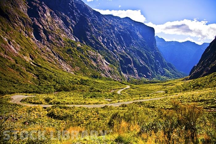 Road to Milford Sound;Fiordland;mountains;hills;rivers;Road;State Highway 94;bush;native forrest;green fields;green paddocks;lakes;blue sky;West side of Homer Tunnel;West side;Homer Tunnel