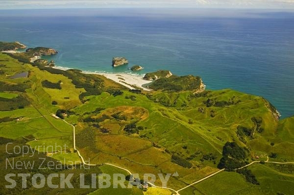 Aerial;Farewell Spit;Golden Bay;Wharariki Beach;hills;rivers;Road;bush;native forrest;golden sands;sand dunes;scrub;blue sky;blue sea;dune grass;bluffs;cliffs;rocks;caves;arches;islands;sandy beaches;rock arches;scenic reserve