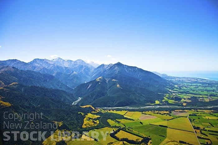 Kaikoura From Inland Rd;Aerial;Inland Kaikoura Road;Kaikoura;bush;native forest;Kahutara River;seaward Kaikoura Range;Kowhai River;green fields;paddocks;brown hills;hills;mountains;rivers;ocean;pacific ocean