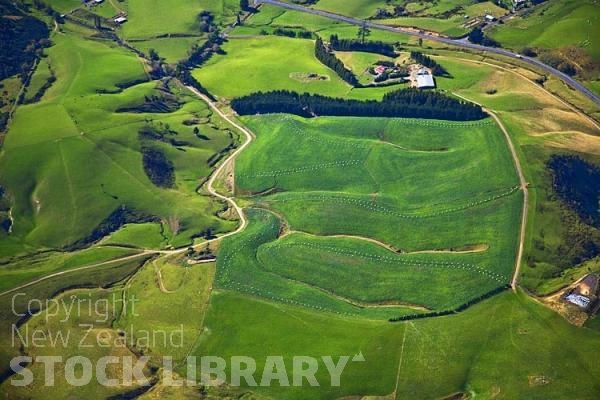 Aerial;The Catlins;Southland;hills;rivers;Road;bush;native forrest;green fields;green paddocks;bluffs;cliffs;River;sheep farming;winter feed;Artful pattern