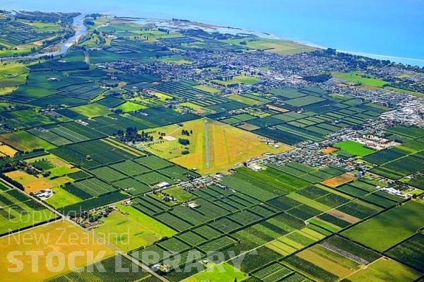 Aerial;Motueka;Moutere;Mapua;Tasman Bay;sandy beaches;beach;beach front;boating;golden sands;inlet waters;inlets;lagoons;coastal road;harbour;Motueka River;airfield;airport;fruit growing;vineyards