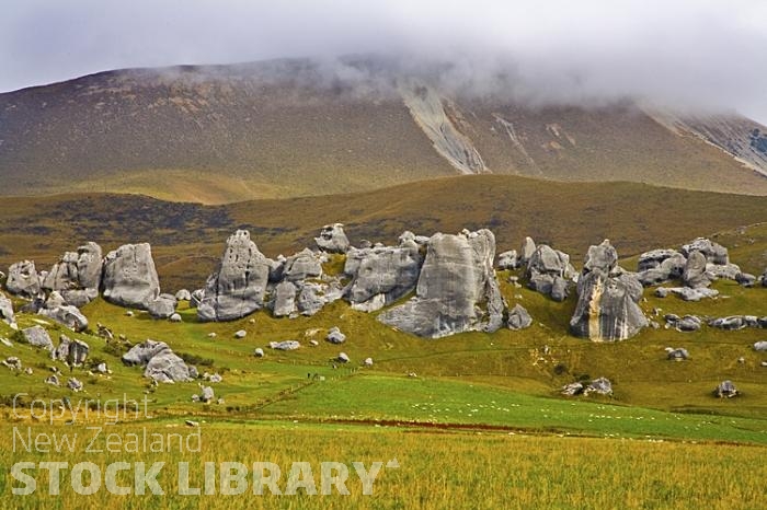 Arthur's Pass Route Canterbury;mountains;hills;Lakes;tussock grass;tussock;bush;native forrest;state highway 73;scree;rocky out crops;boulders;sheep;low cloud;limestone rocks;limestone;paddocks